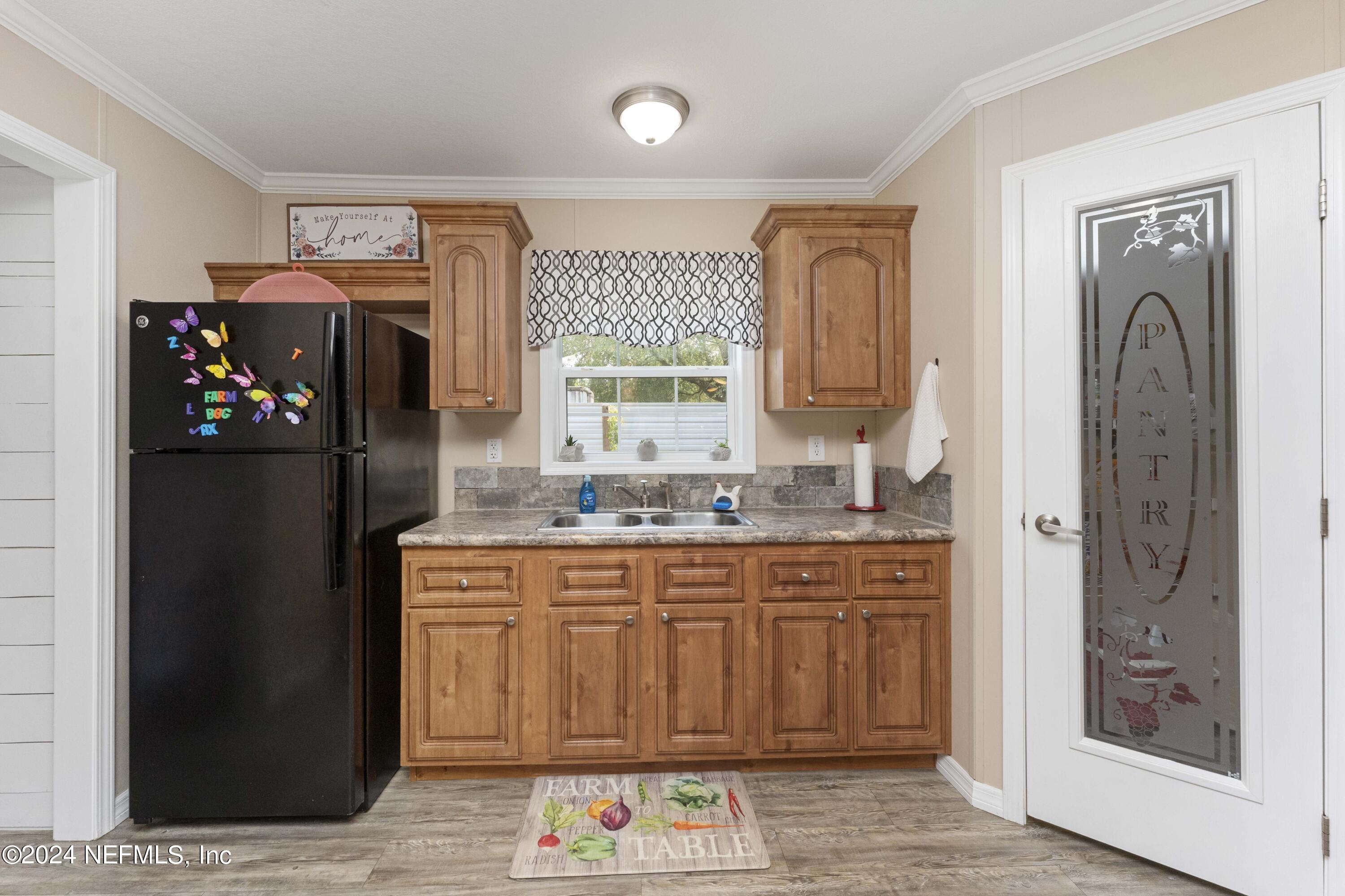 4866 Reed Avenue Jacksonville, FL 32257 - Photo 6 of 25 a kitchen with stainless steel appliances granite countertop a refrigerator and a stove