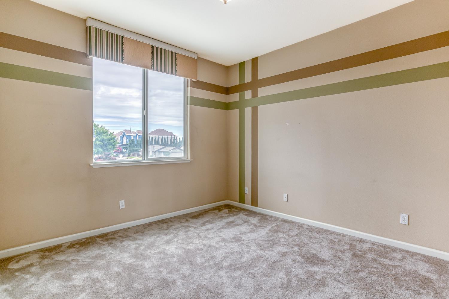 188 Thomsen Road Lathrop, CA 95330 - Photo 19 of 27 a view of an empty room with a window