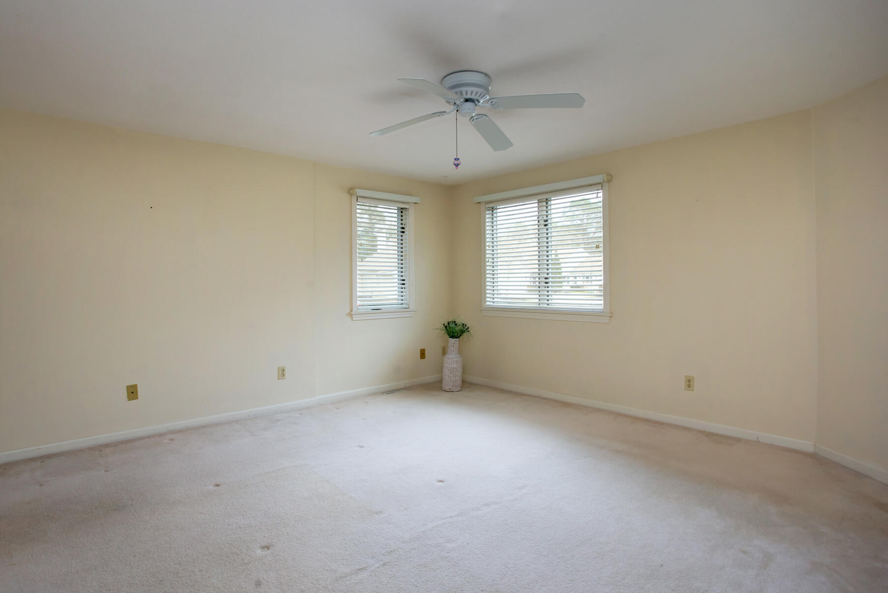 8 Kettle Lane Mashpee, MA 02649 - Photo 15 of 28 an empty room with a window and a ceiling fan