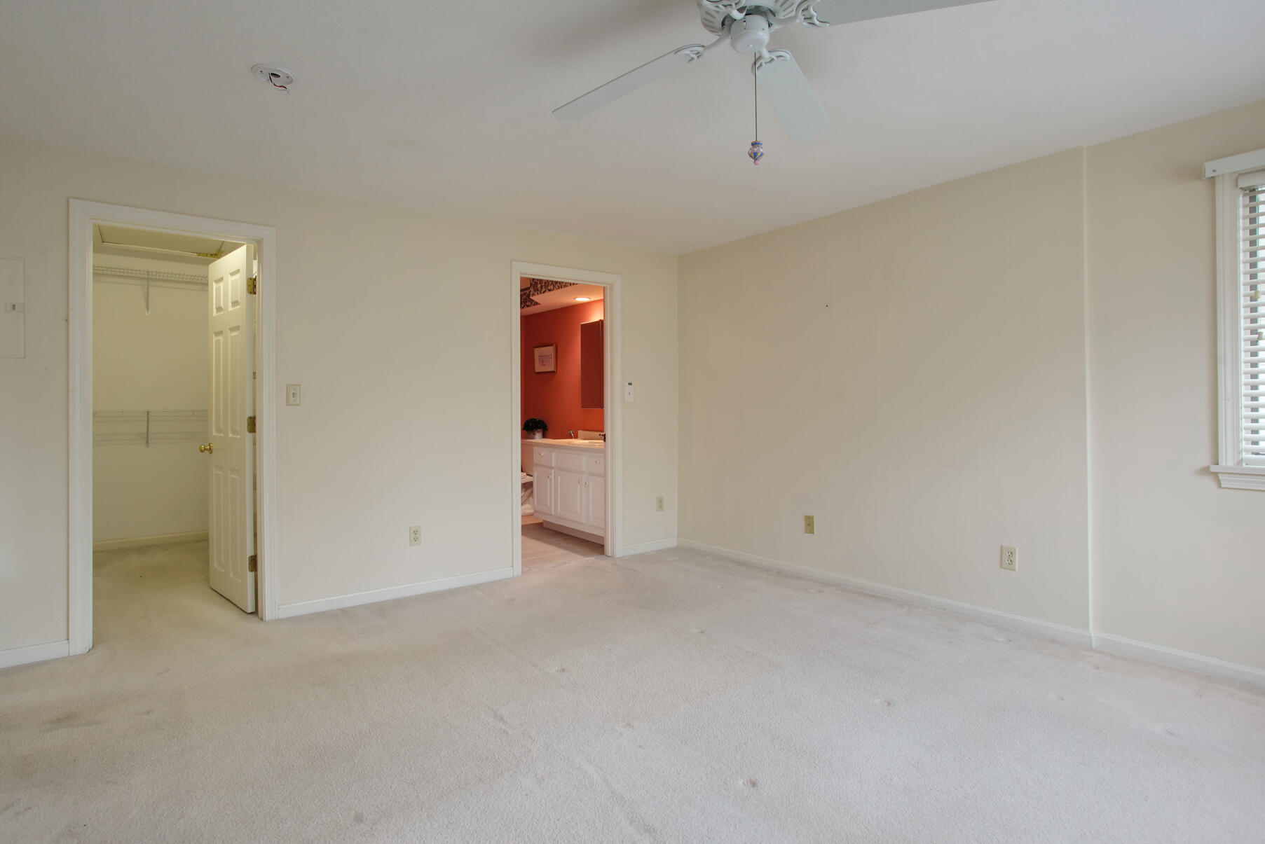 8 Kettle Lane Mashpee, MA 02649 - Photo 16 of 28 an empty room with a ceiling fan and a window