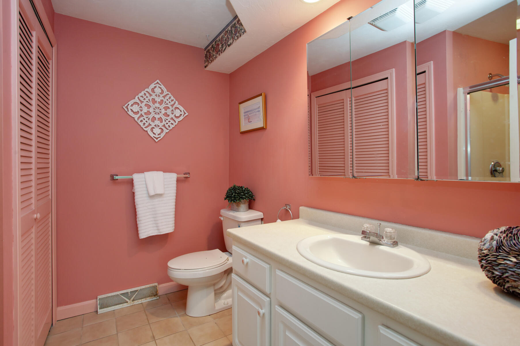8 Kettle Lane Mashpee, MA 02649 - Photo 17 of 28 a bathroom with a toilet sink and mirror