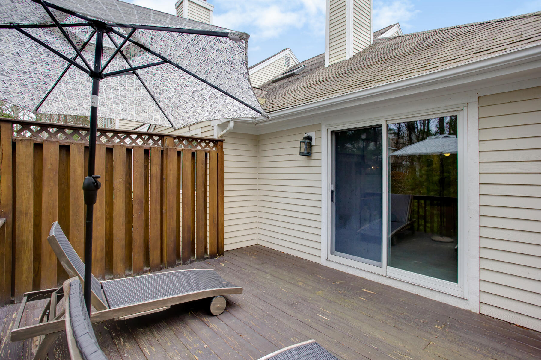 8 Kettle Lane Mashpee, MA 02649 - Photo 26 of 28 a view of a patio with wooden wall