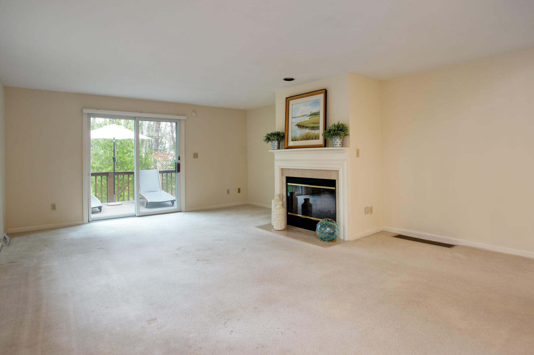 8 Kettle Lane Mashpee, MA 02649 - Photo 8 of 28 an empty room with windows and fireplace