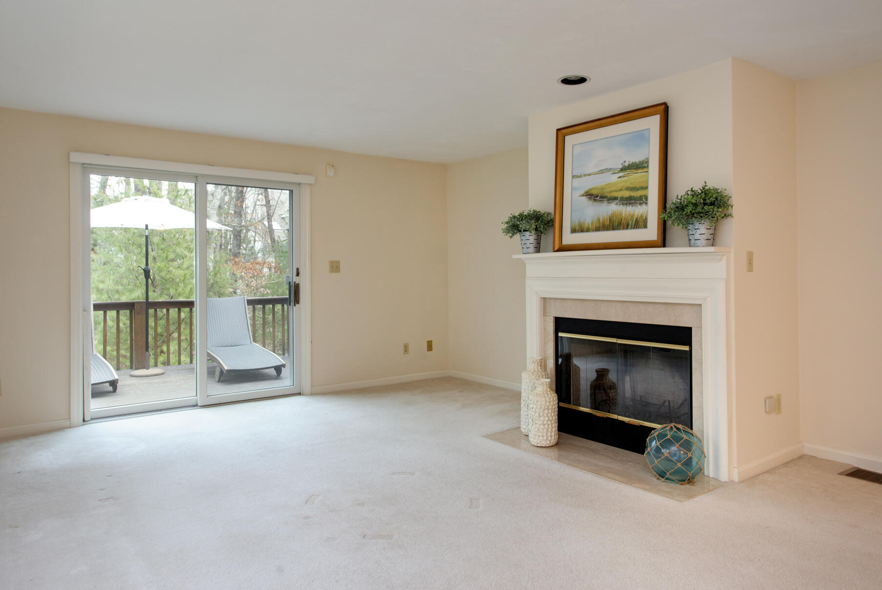 8 Kettle Lane Mashpee, MA 02649 - Photo 9 of 28 a view of an empty room with a fireplace