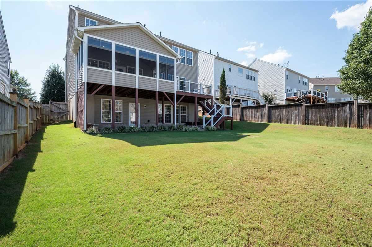 7810 San Gabriel Street Raleigh, NC 27613 - Photo 16 of 29 Fenced backyard, three season room, deck and lower level patio Backyard