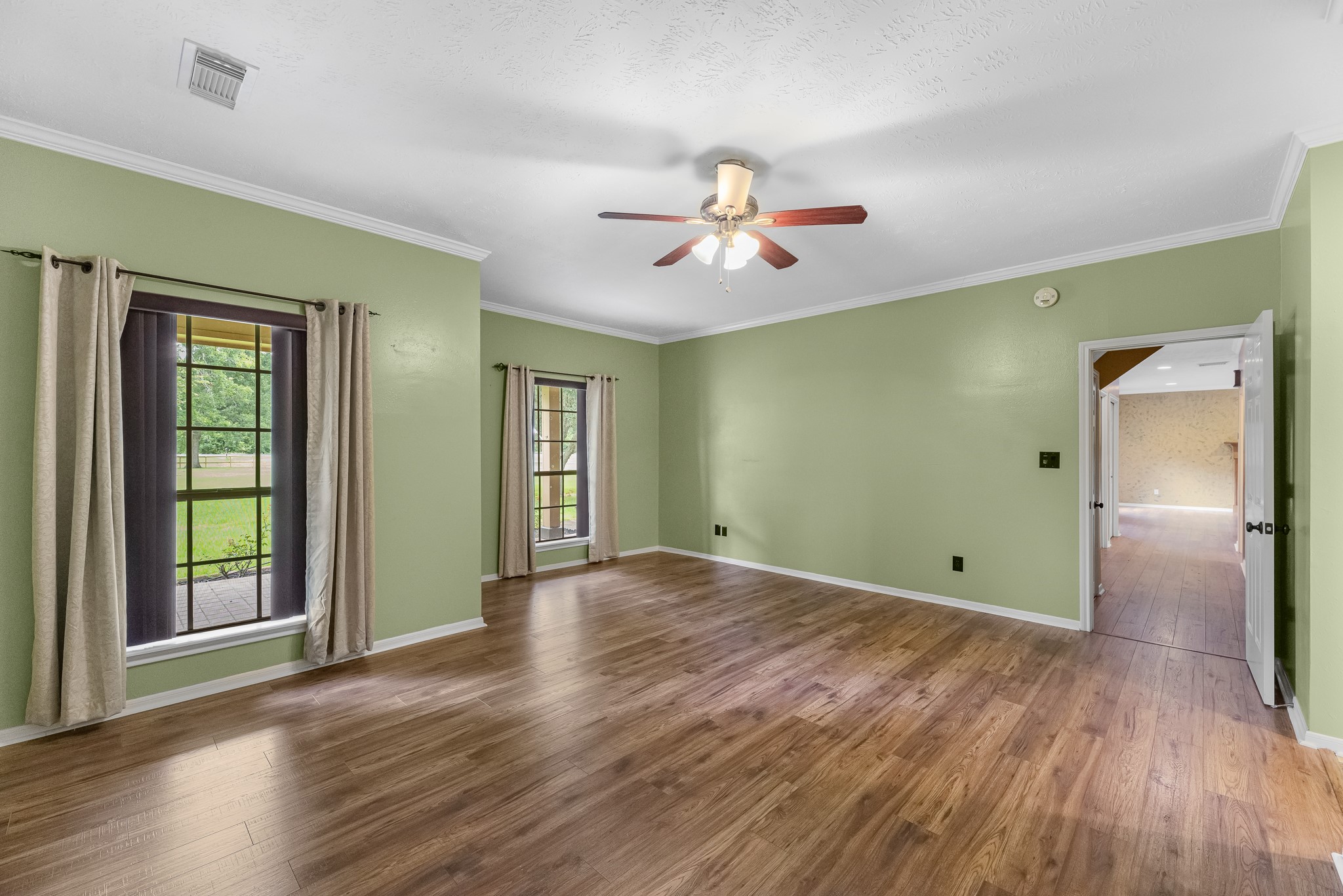 17126 County Road 39 Rosharon, TX 77583 - Photo 10 of 47 Large primary suite with sitting area. Located for privacy behind the stairs. Two large walk in closets with built-ins.