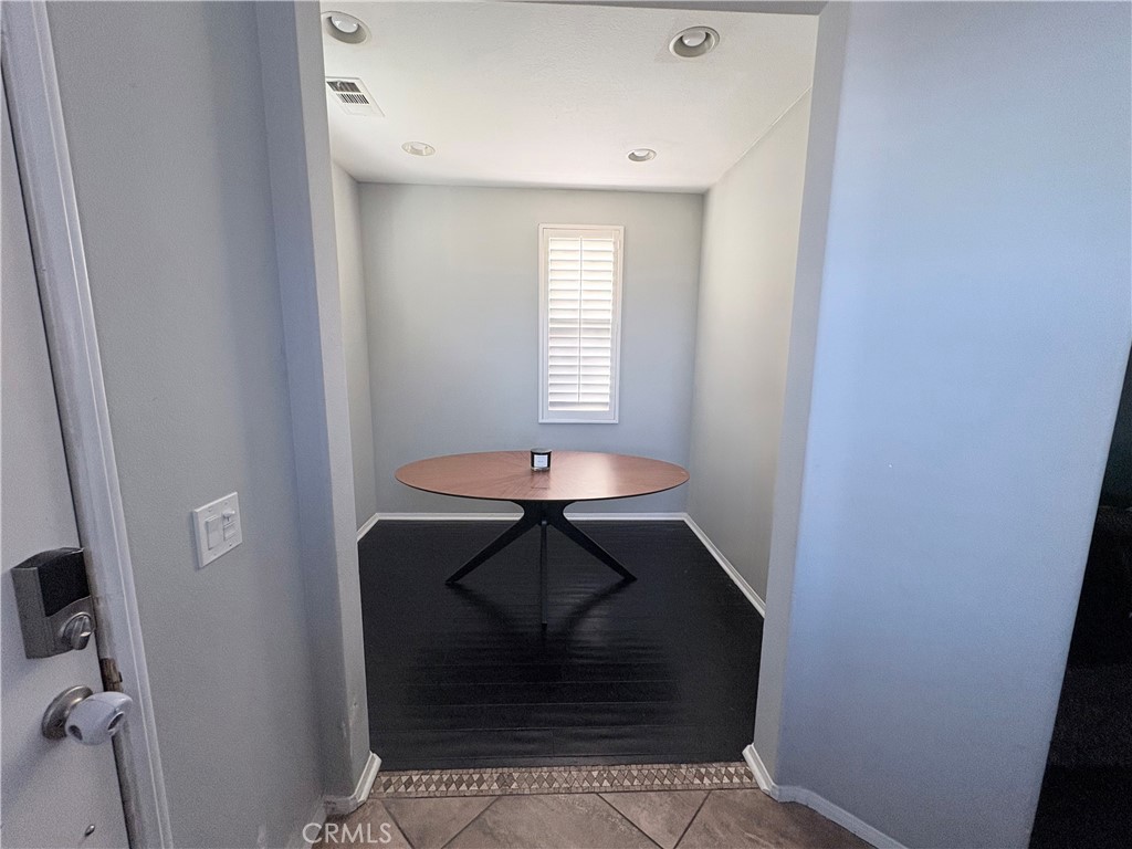 2729 Hornbeam Road Palmdale, CA 93551 - Photo 6 of 35 a room with a table and a window