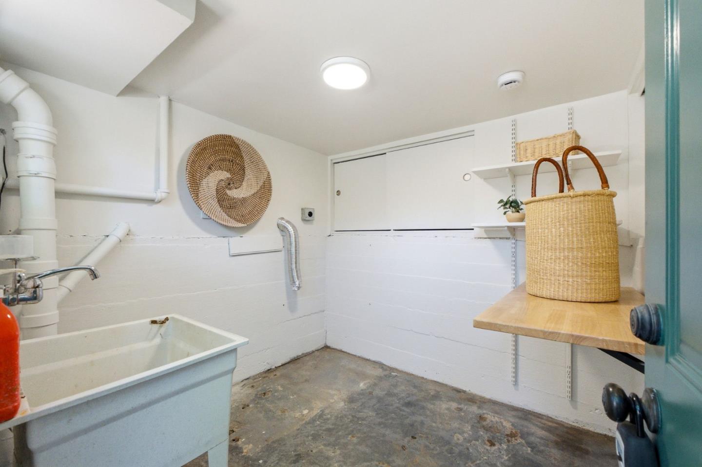 9858 Golf Links Road Oakland, CA 94605 - Photo 33 of 39 a bathroom with a sink and a bathtub