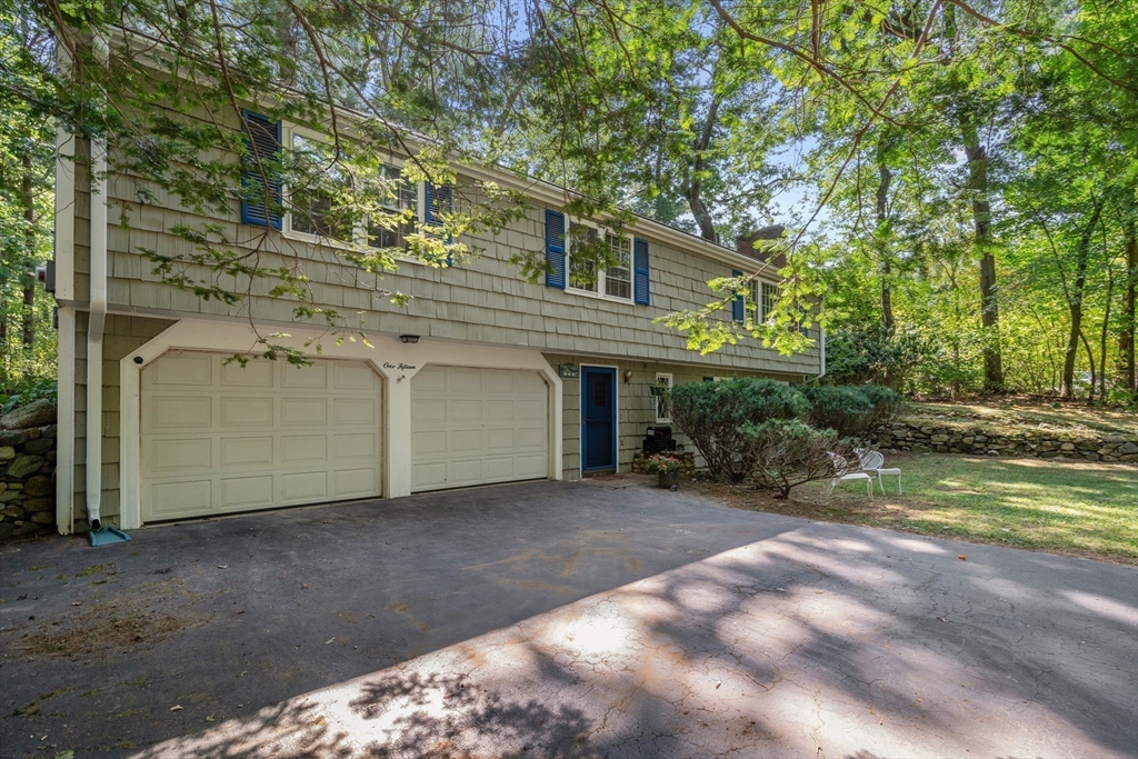 115 Woodside Road Sudbury, MA 01776 - Photo 4 of 42 a view of a house with backyard and trees