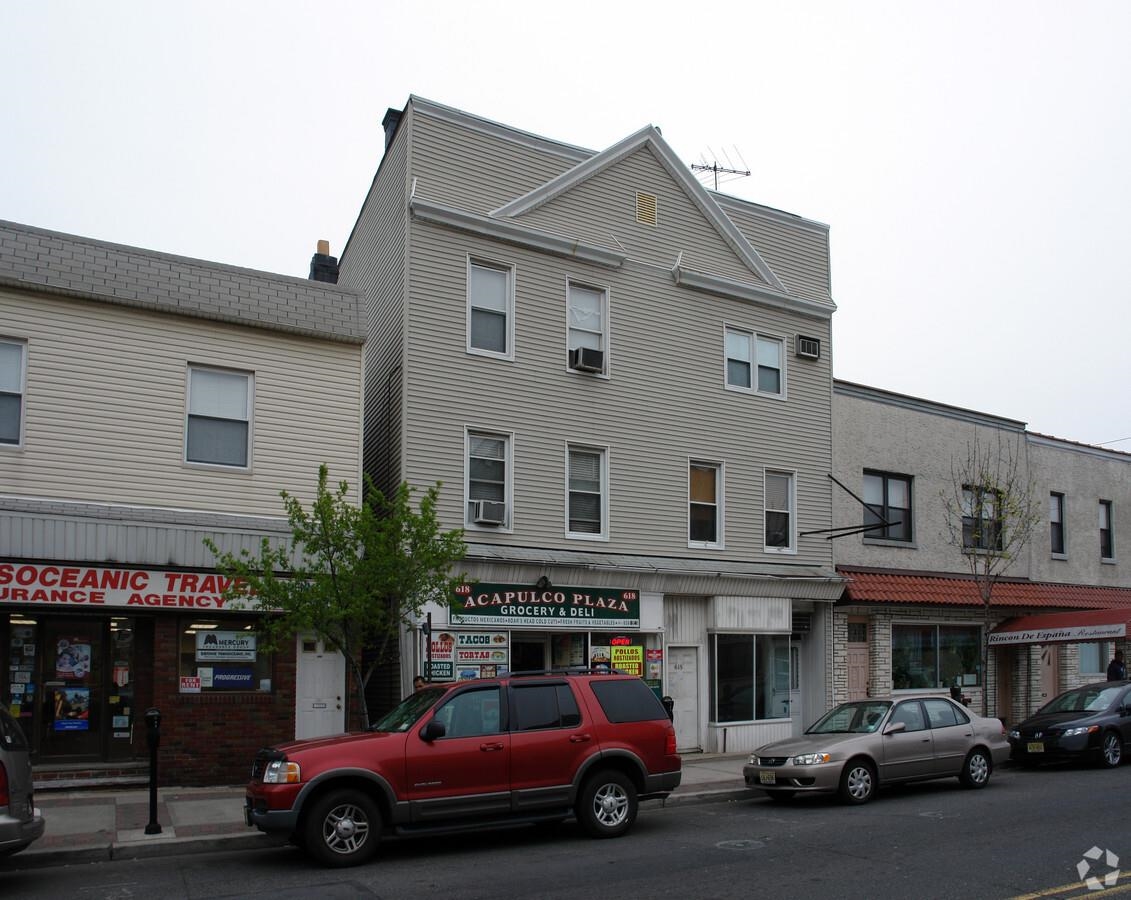 618 Broadway, Unit 5 Bayonne, NJ 07002 - Photo 1 of 9 a car parked in front of a building