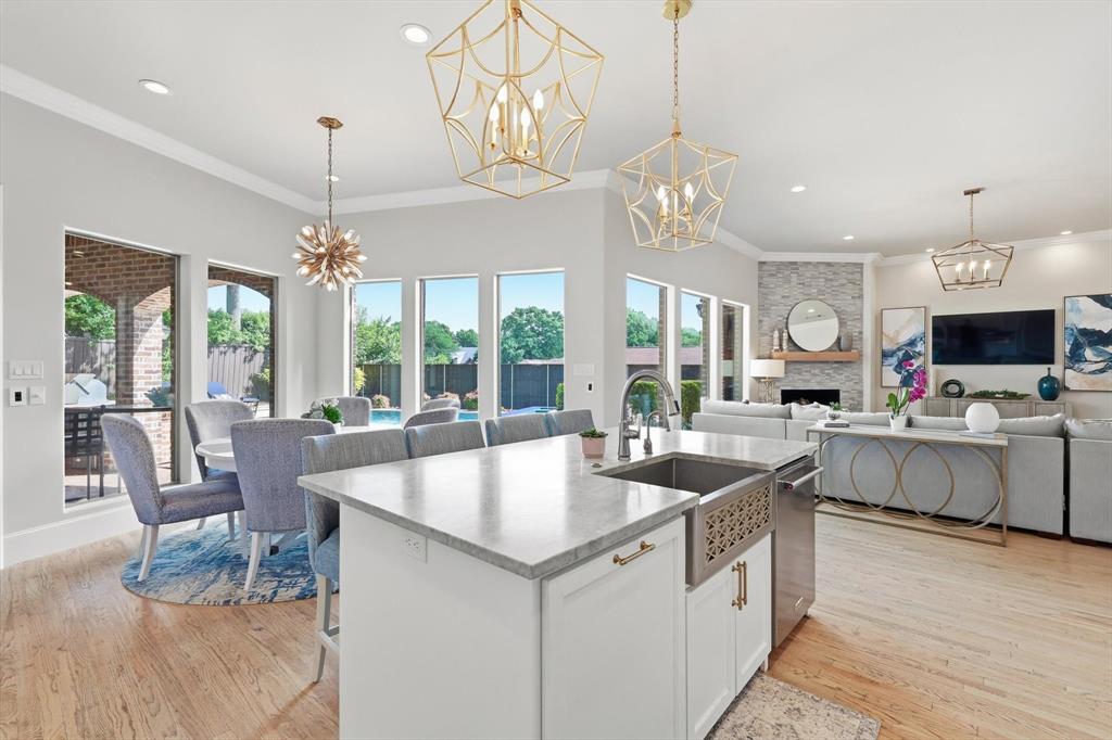 476 Hidden Valley Lane Coppell, TX 75019 - Photo 10 of 40 a very nice looking kitchen with a large island in the center