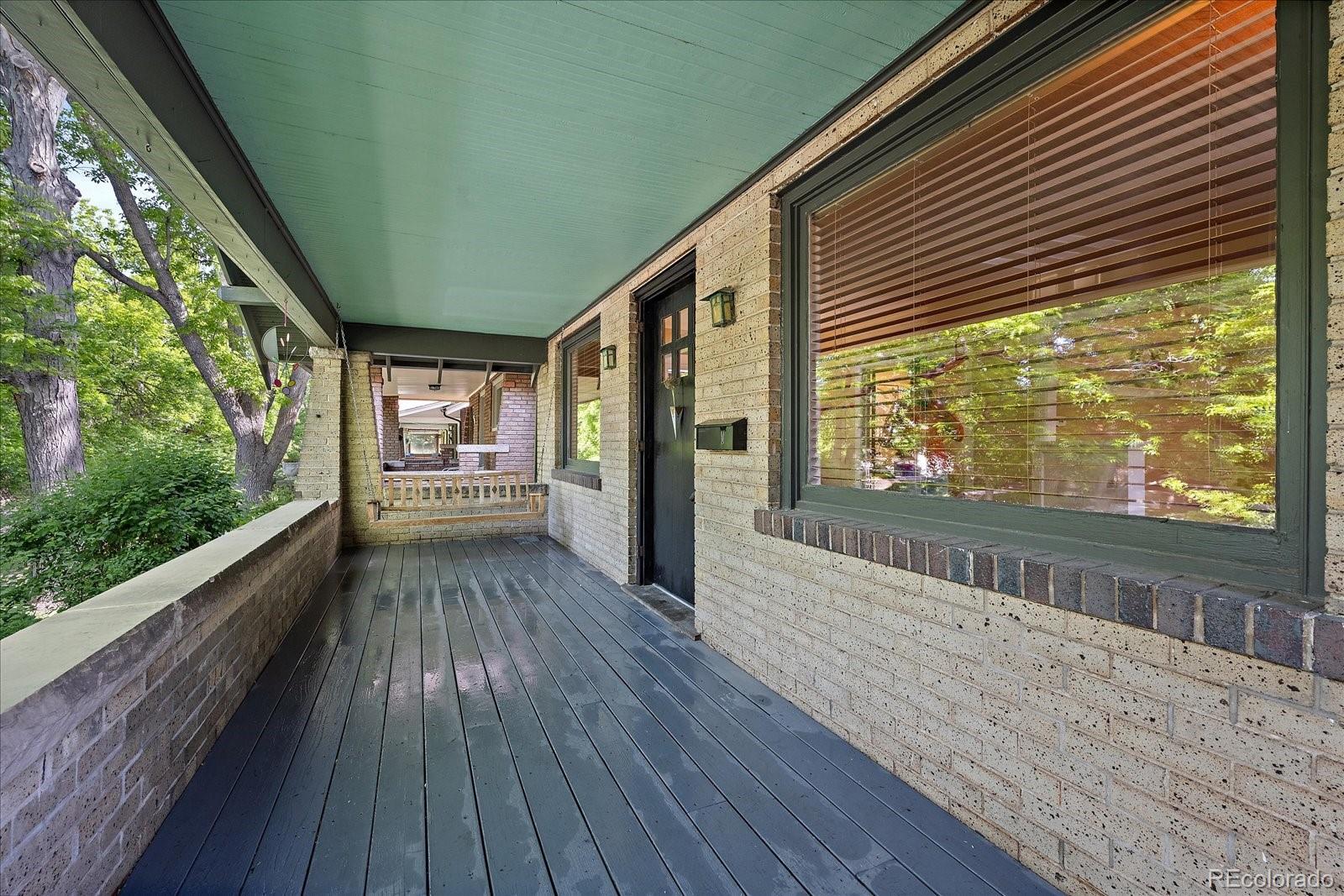 756 Steele Street Denver, CO 80206 - Photo 2 of 32 a view of a house with a porch