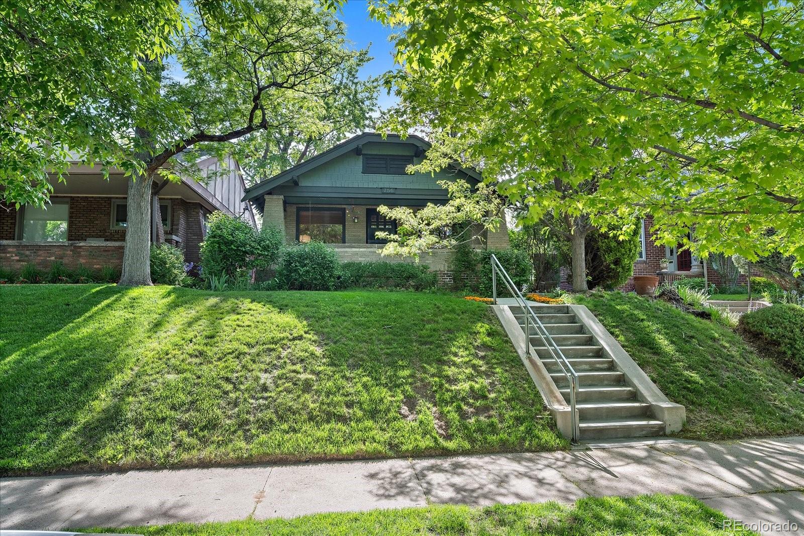 756 Steele Street Denver, CO 80206 - Photo 30 of 32 a front view of a house with a yard