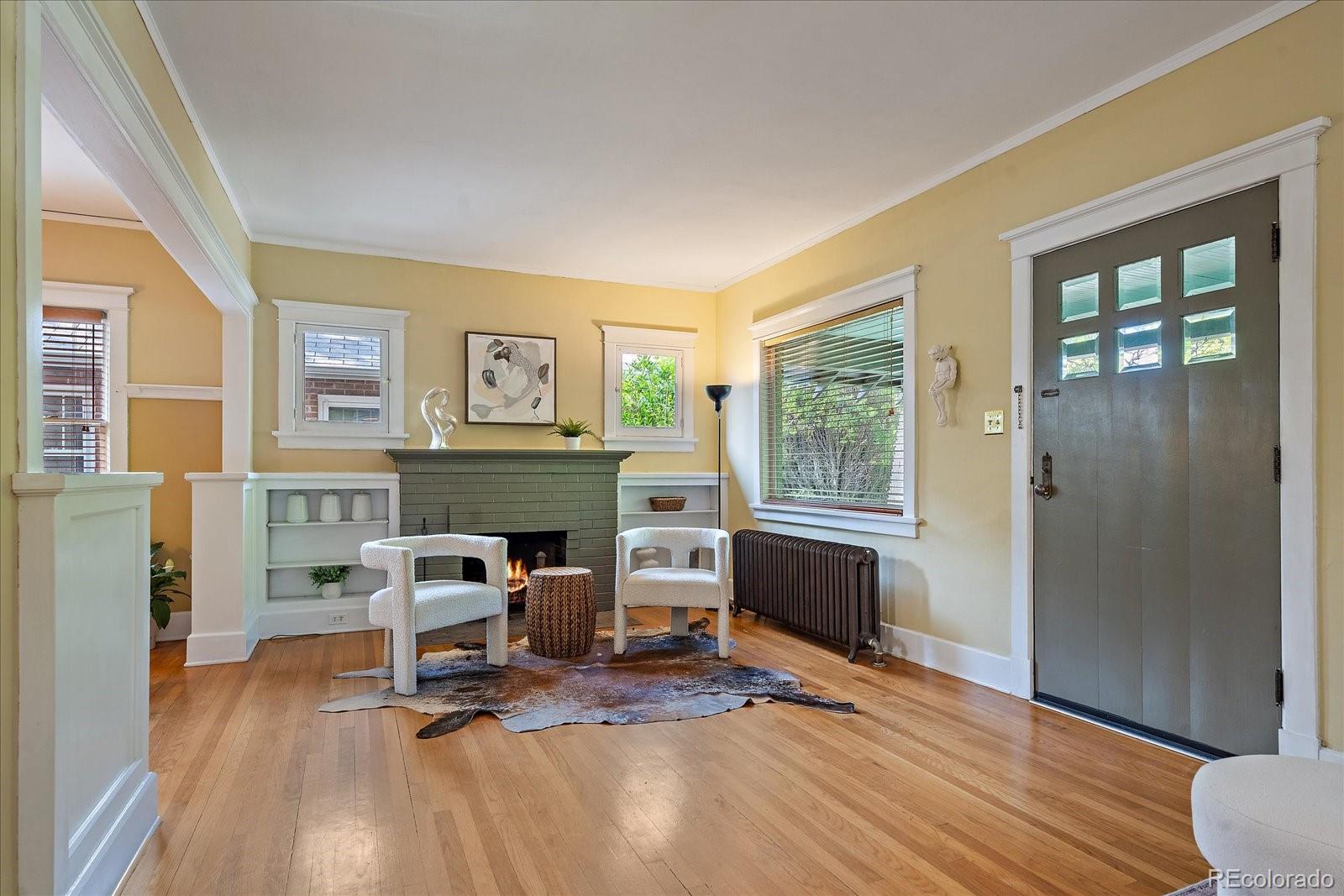 756 Steele Street Denver, CO 80206 - Photo 5 of 32 a view of a workspace with furniture and a window
