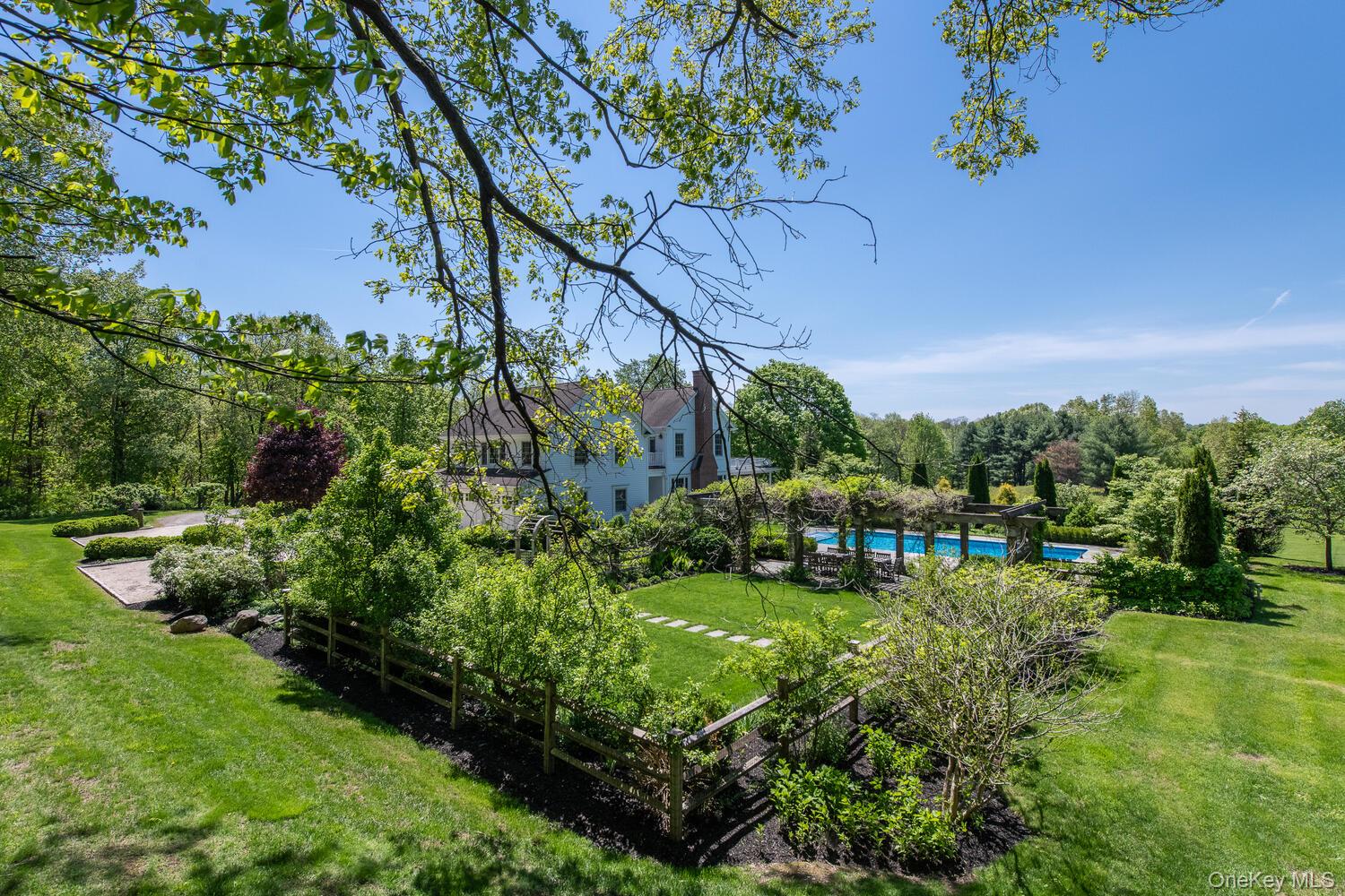 33 Pells Road Rhinebeck, NY 12572 - Photo 2 of 50 a view of a garden with a building in the background