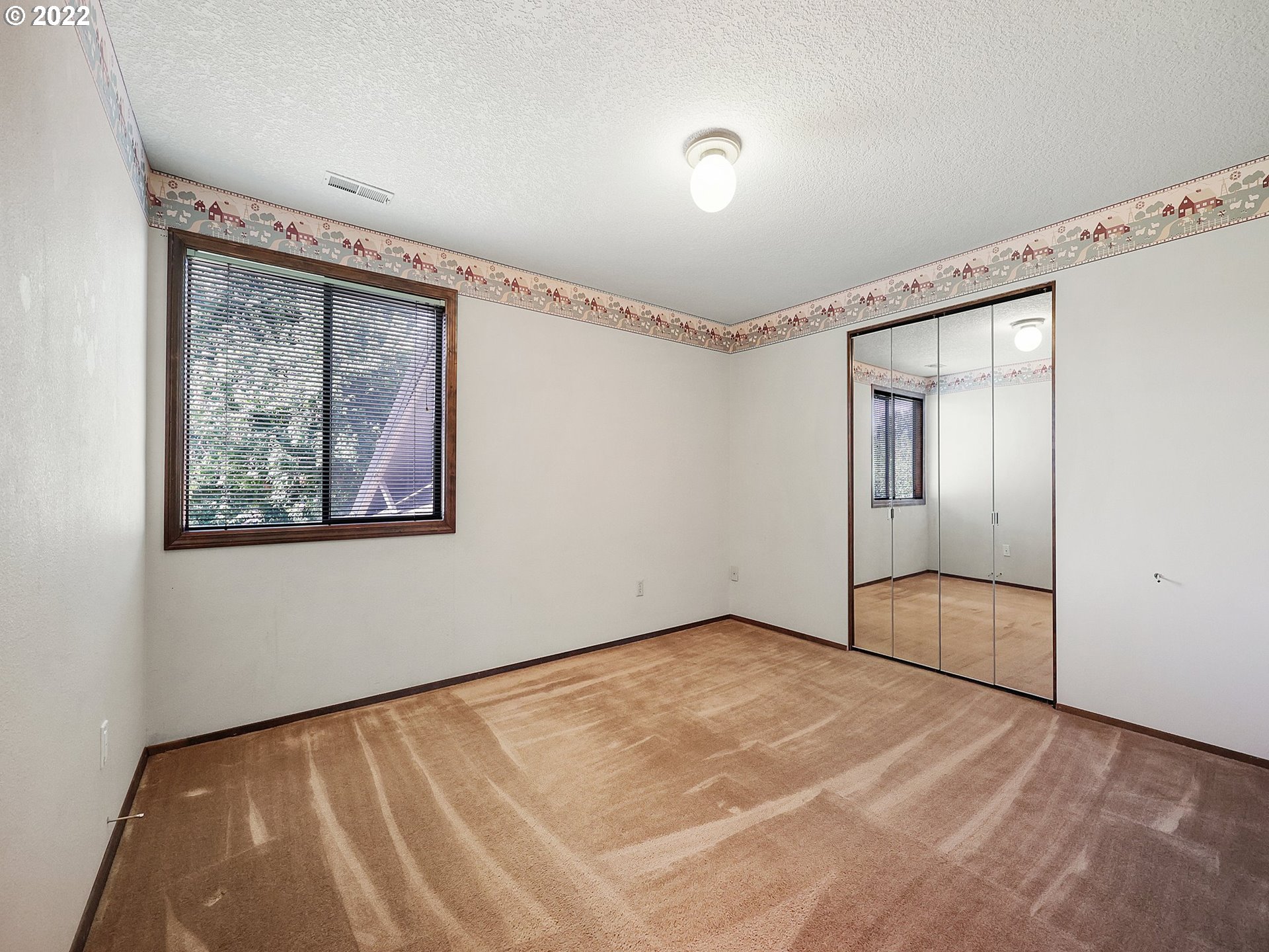 9696 South Gribble Road Canby, OR 97013 - Photo 19 of 32 a view of an empty room with a window