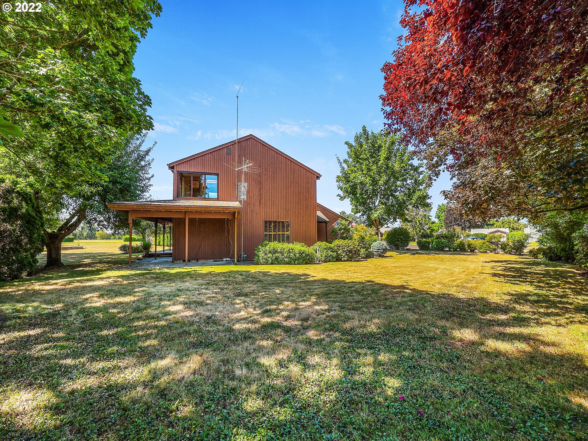 9696 South Gribble Road Canby, OR 97013 - Photo 25 of 32 a front view of a house with a yard