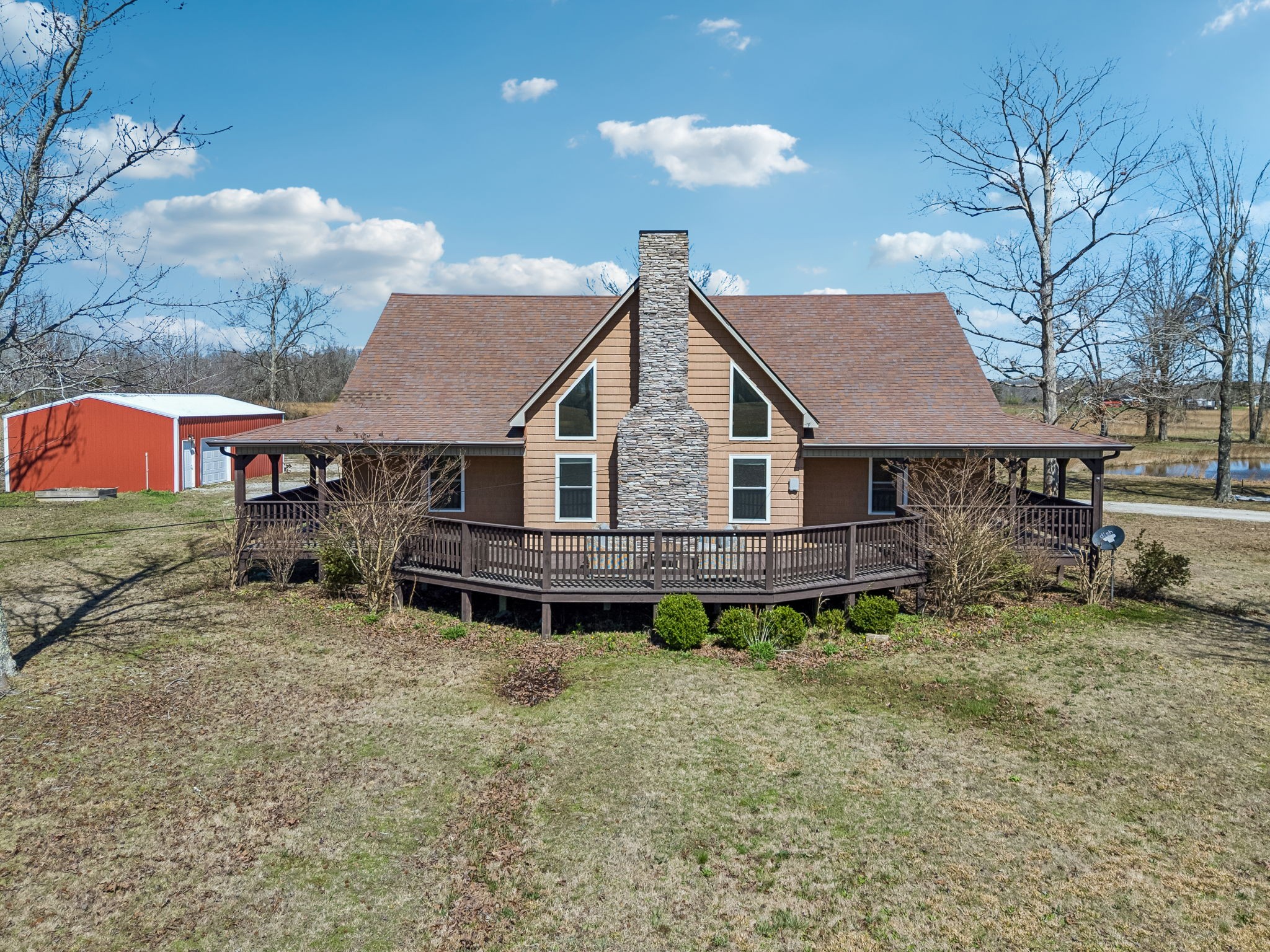 267 Switzerland Road Hohenwald, TN 38462 - Photo 77 of 98 a aerial view of a house with yard and sitting area