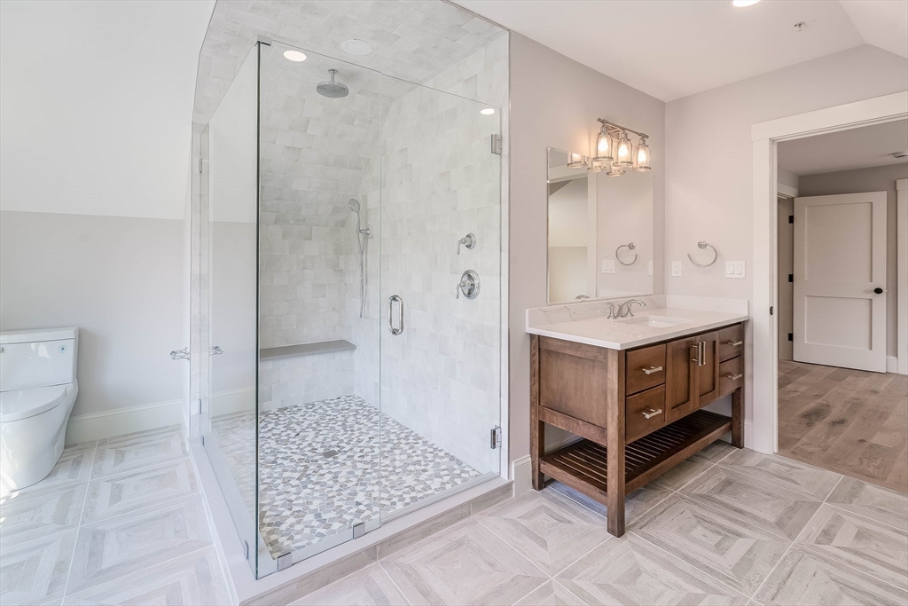 2 Punchard Avenue, Unit 3 Andover, MA 01810 - Photo 13 of 30 a bathroom with a sink a toilet and shower