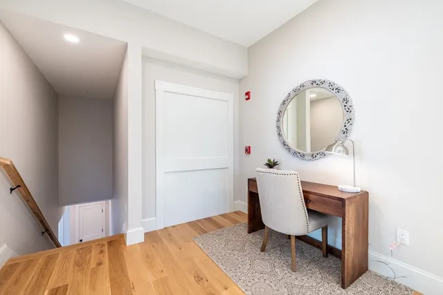 a workspace with furniture and mirror