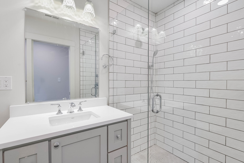 2 Punchard Avenue, Unit 3 Andover, MA 01810 - Photo 17 of 30 a bathroom with a sink shower and a mirror