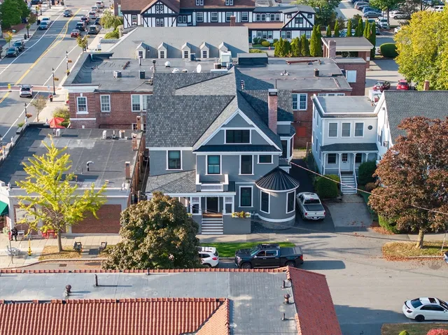 an aerial view of a house with swimming pool