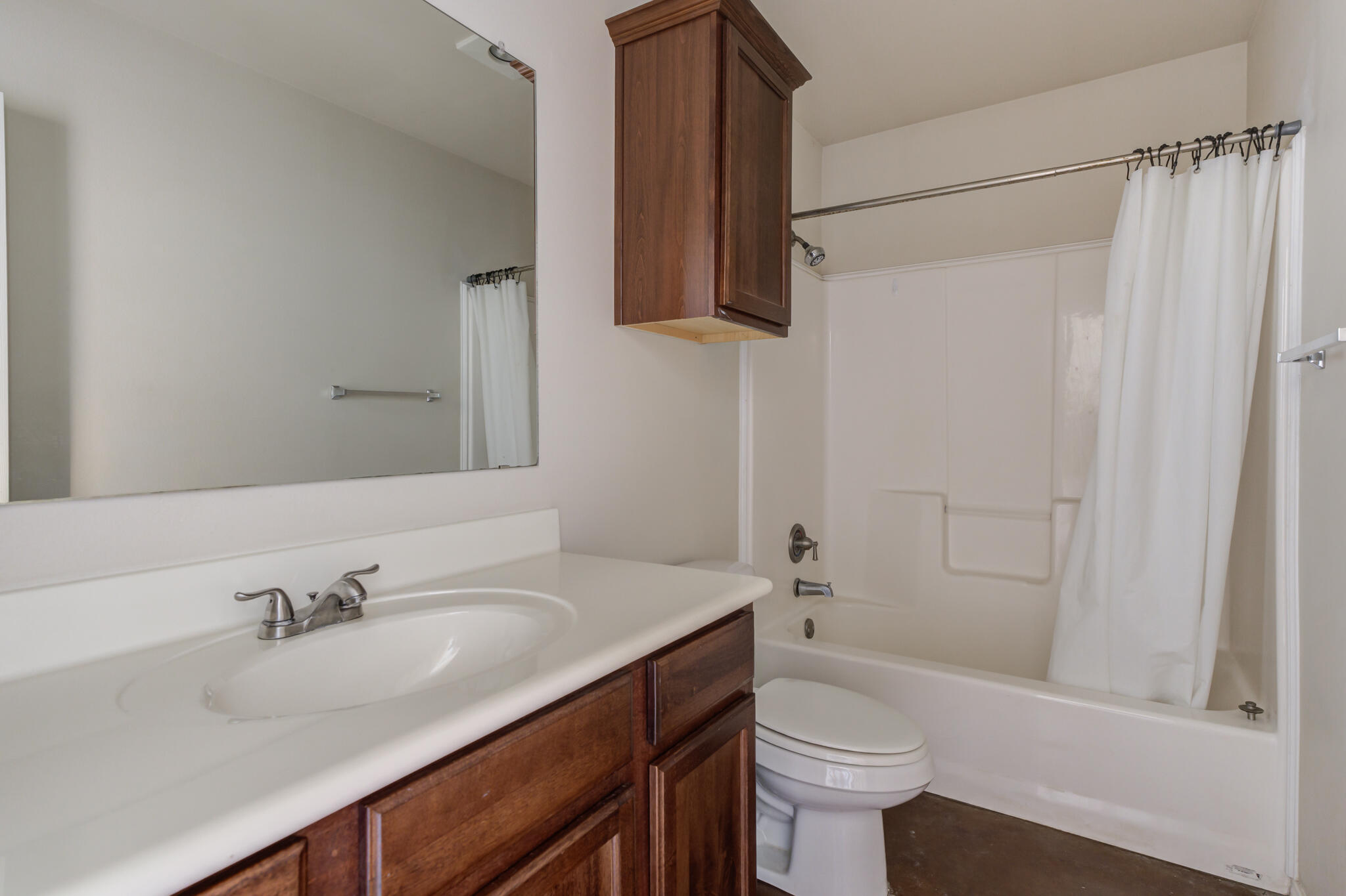 1240 Wheelock Street Lubbock, TX 79403 - Photo 16 of 19 a bathroom with a sink a toilet and shower