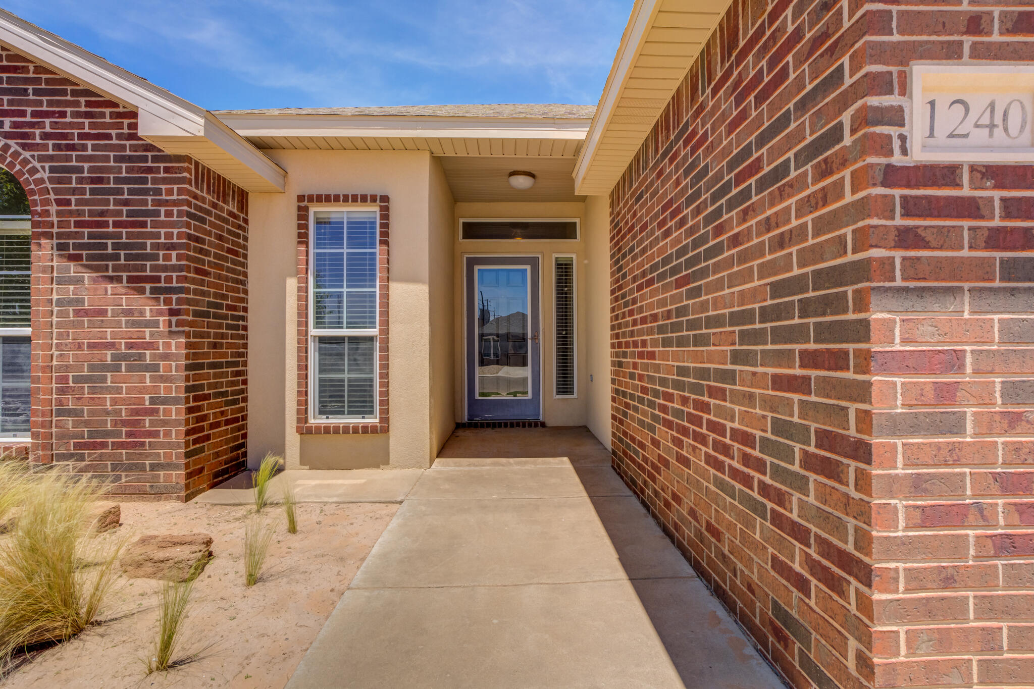 1240 Wheelock Street Lubbock, TX 79403 - Photo 2 of 19 a view of a brick house with windows