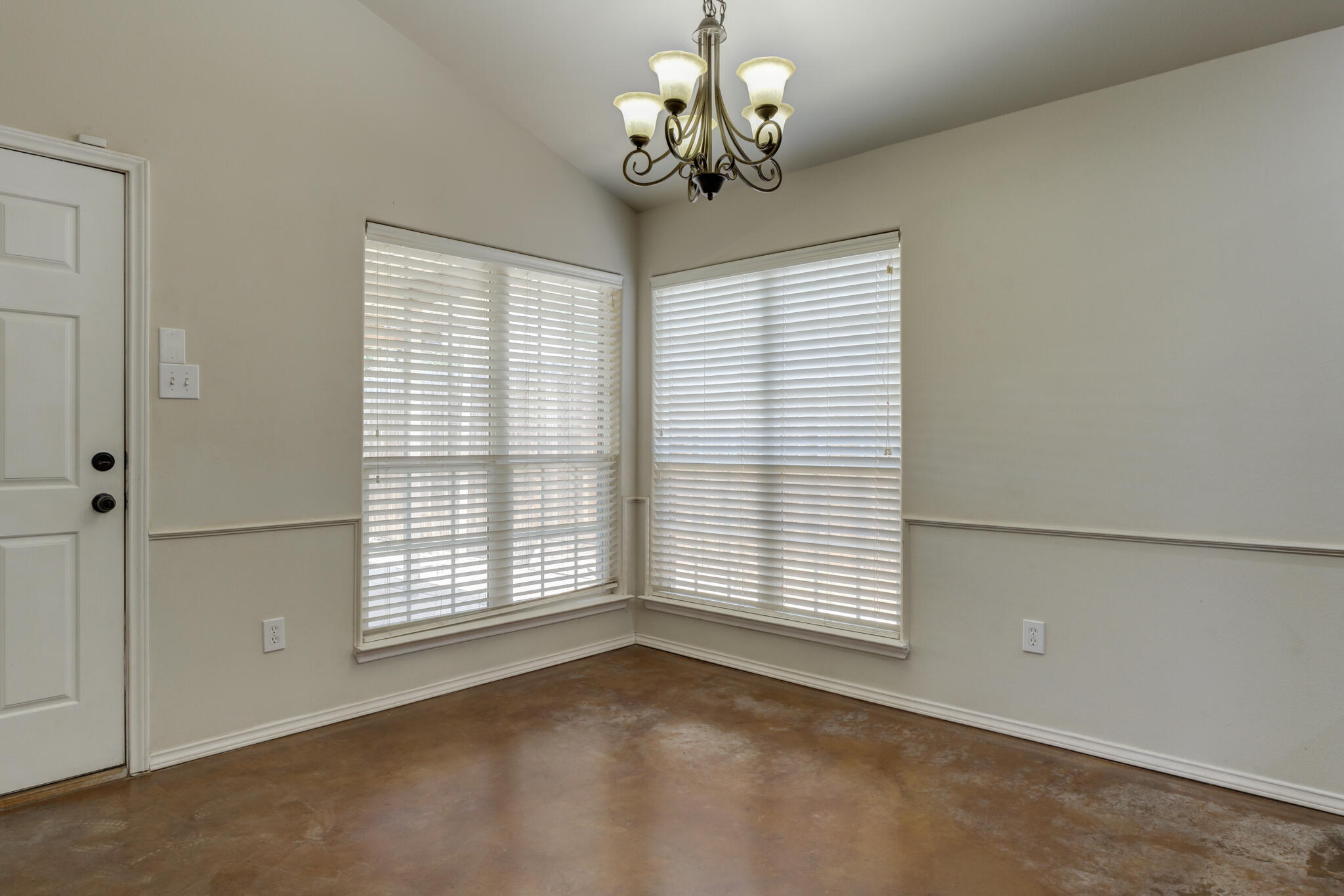 1240 Wheelock Street Lubbock, TX 79403 - Photo 8 of 19 a view of an empty room with a window