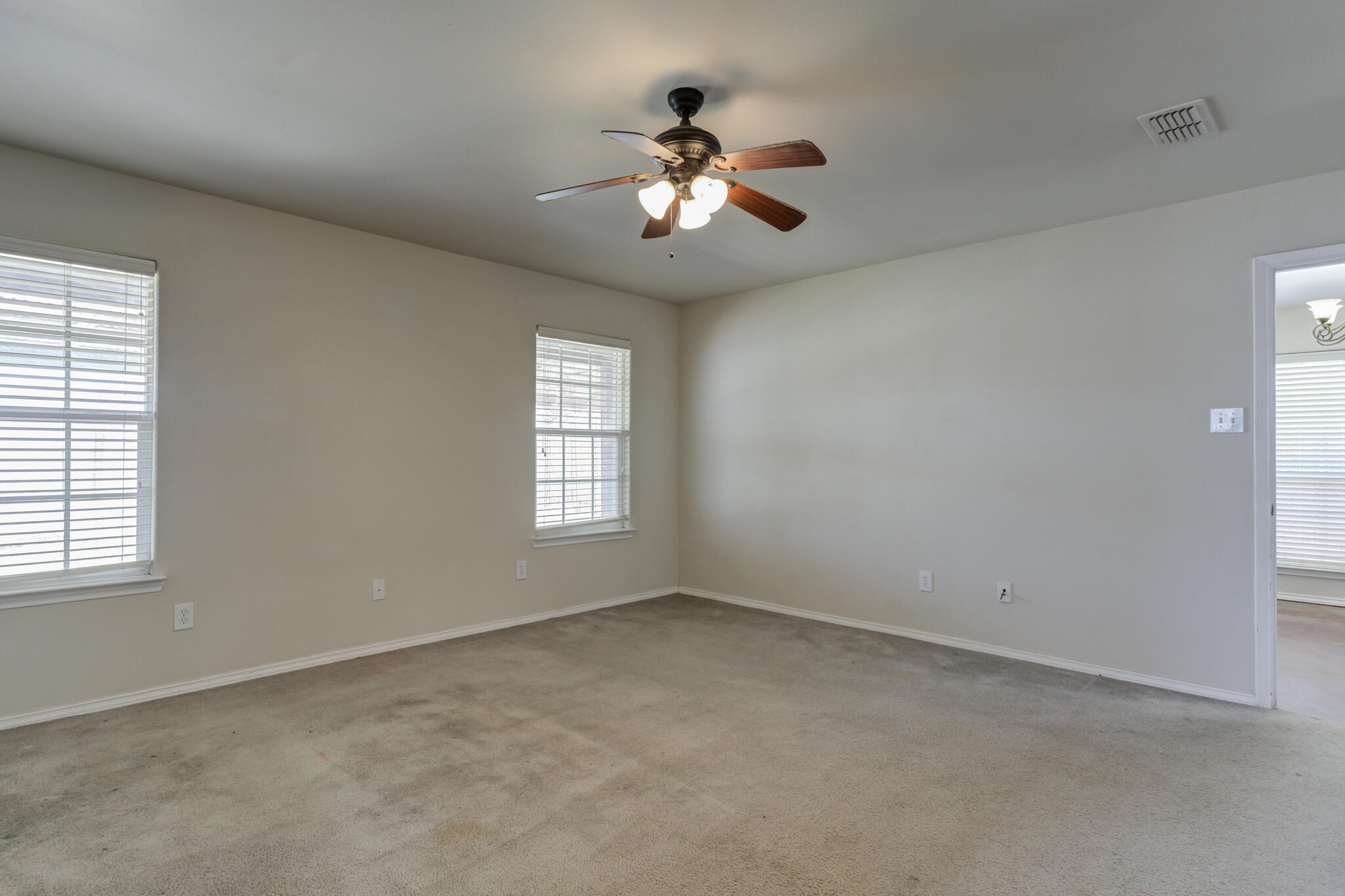 1240 Wheelock Street Lubbock, TX 79403 - Photo 10 of 19 a view of an empty room with a window
