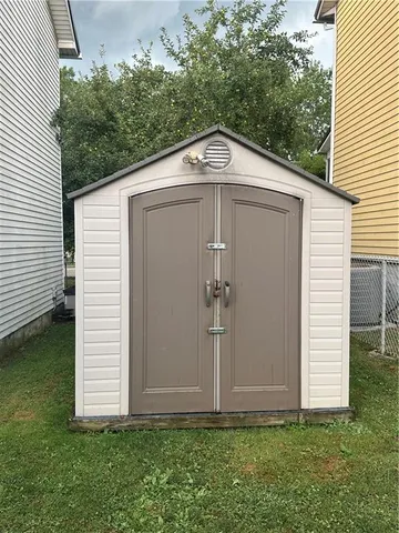 a front view of house with garden