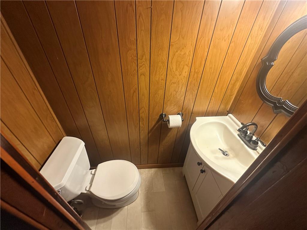 115 Rainey Avenue Uledi, PA 15484 - Photo 9 of 18 a bathroom with a sink mirror vanity and toilet