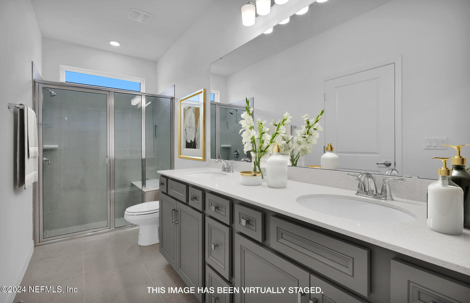 152 Flintlock Lane St. Augustine, FL 32095 - Photo 14 of 40 a bathroom with a double vanity sink toilet and shower