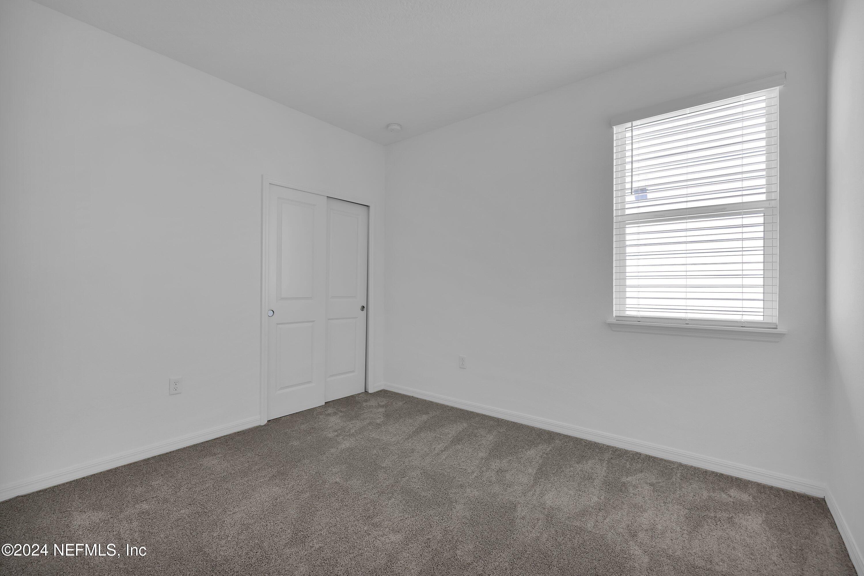 152 Flintlock Lane St. Augustine, FL 32095 - Photo 15 of 40 an empty room with a window