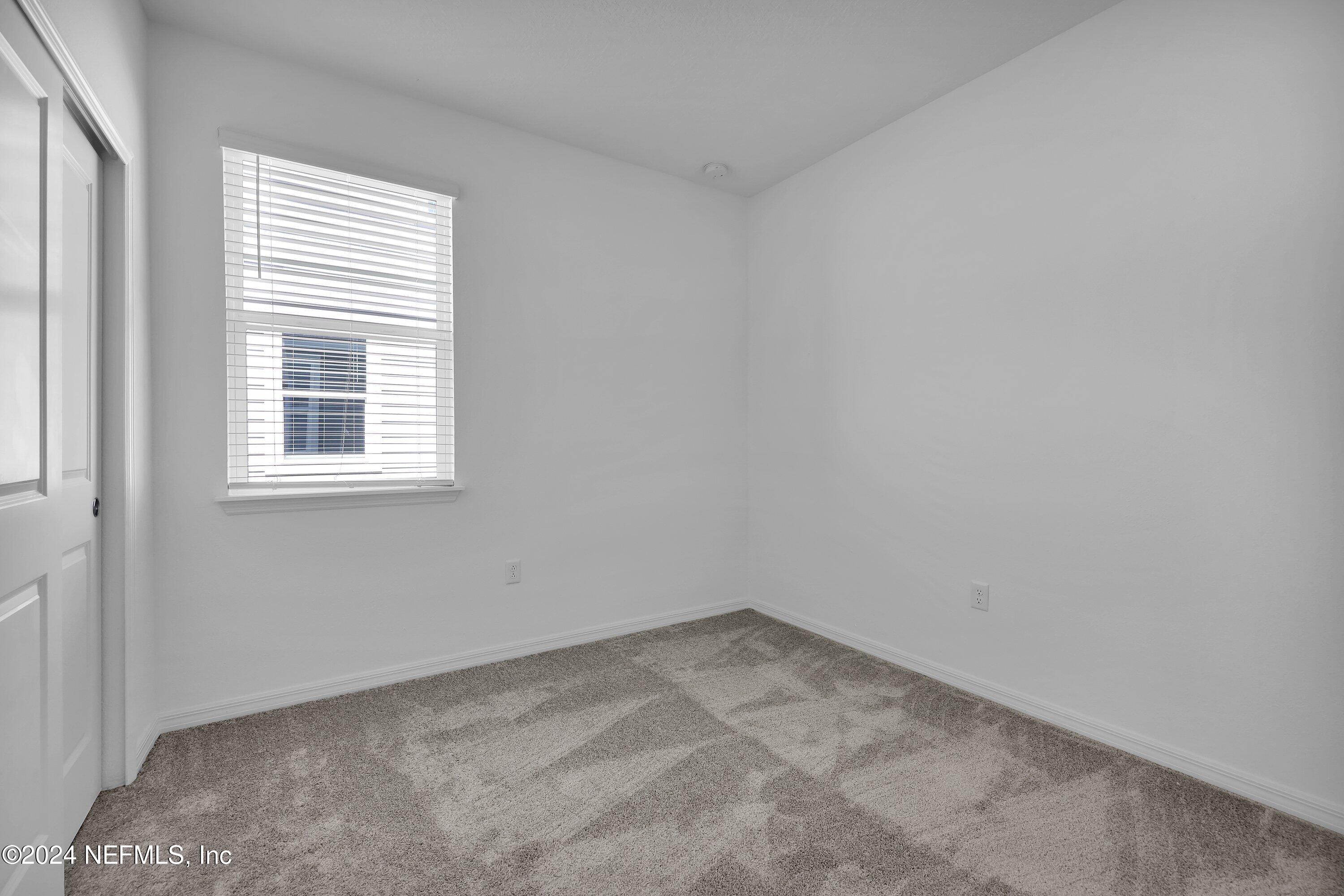 152 Flintlock Lane St. Augustine, FL 32095 - Photo 17 of 40 an empty room with a window