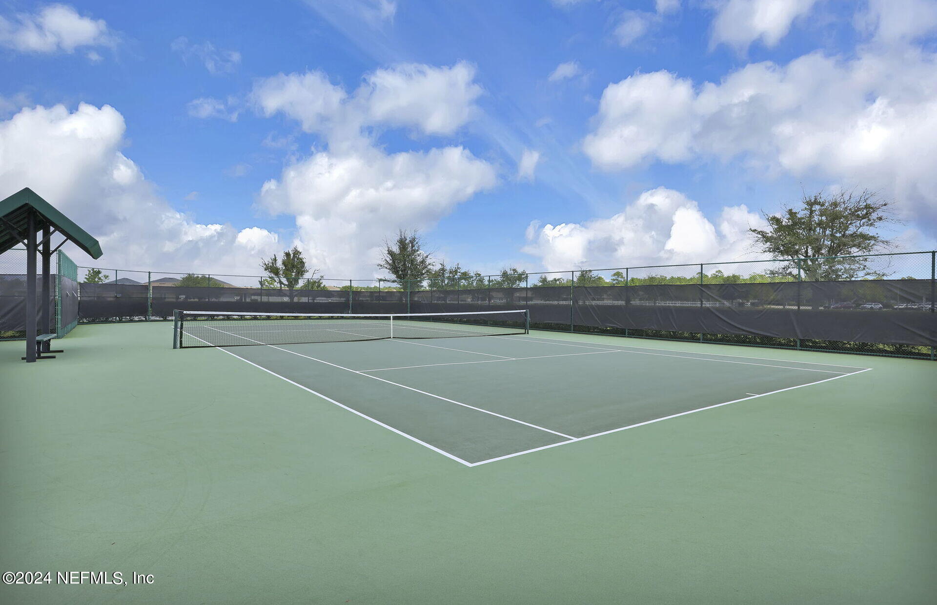 152 Flintlock Lane St. Augustine, FL 32095 - Photo 30 of 40 a view of an outdoor space and tennis court