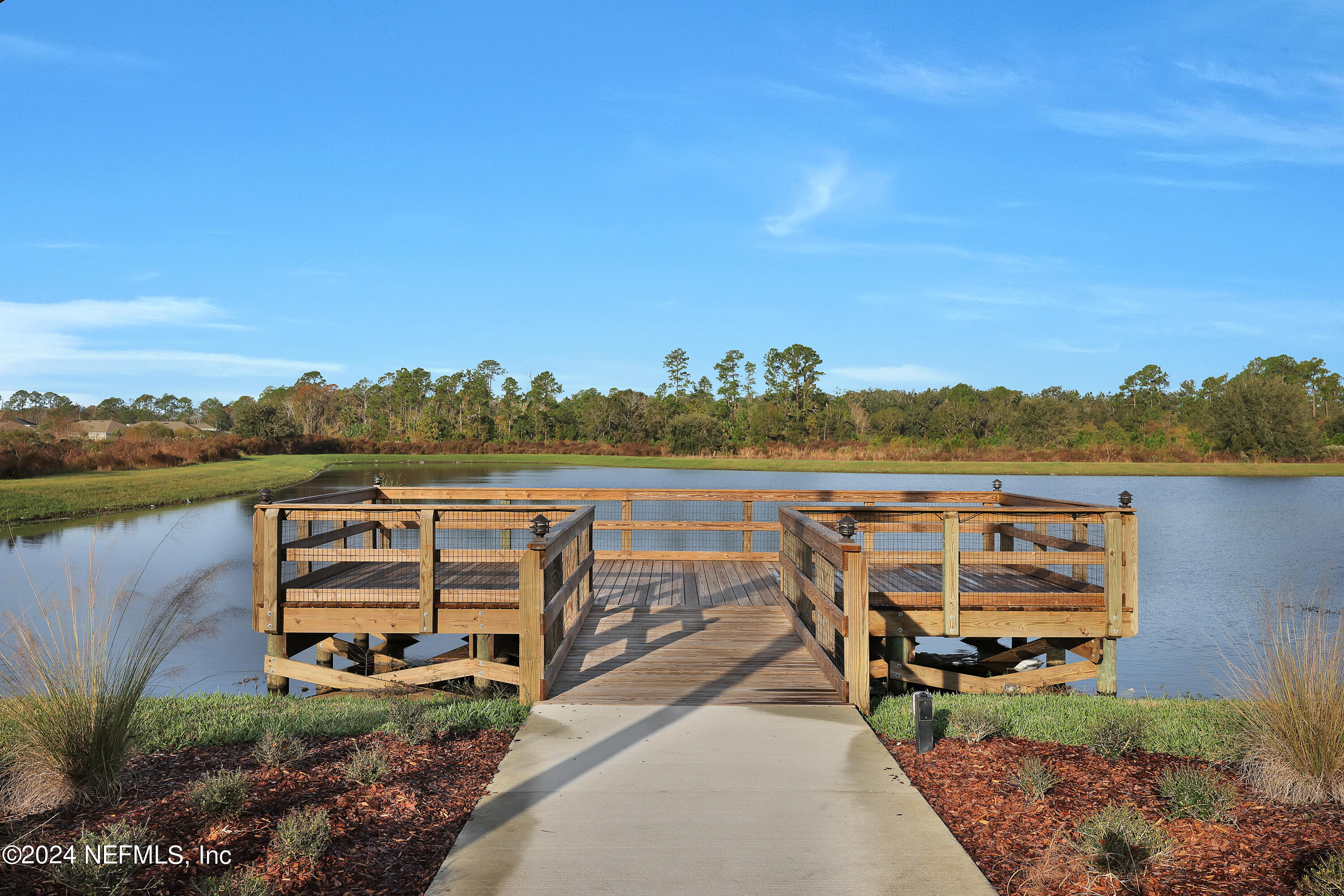 152 Flintlock Lane St. Augustine, FL 32095 - Photo 37 of 40 a view of a lake with sitting area
