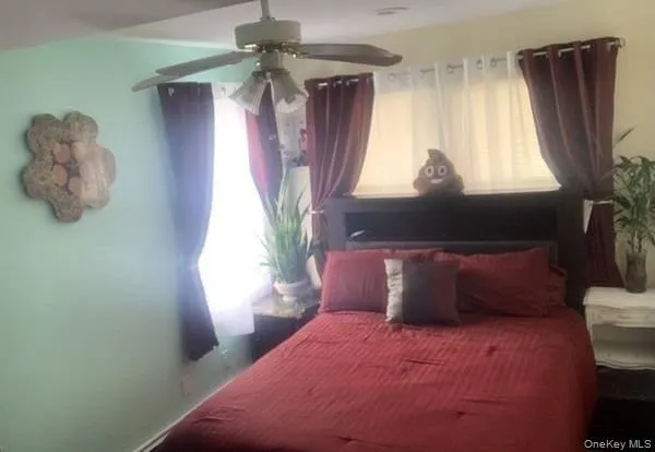 a bedroom with a bed and window