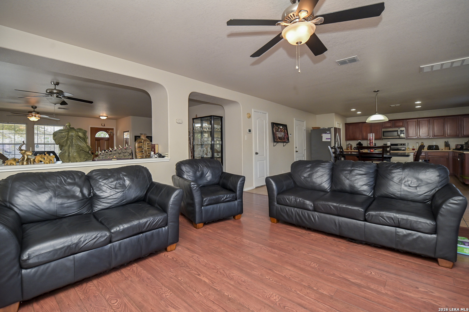 7207 Avery Road Live Oak, TX 78233 - Photo 14 of 42 a view of a livingroom with furniture and a ceiling fan
