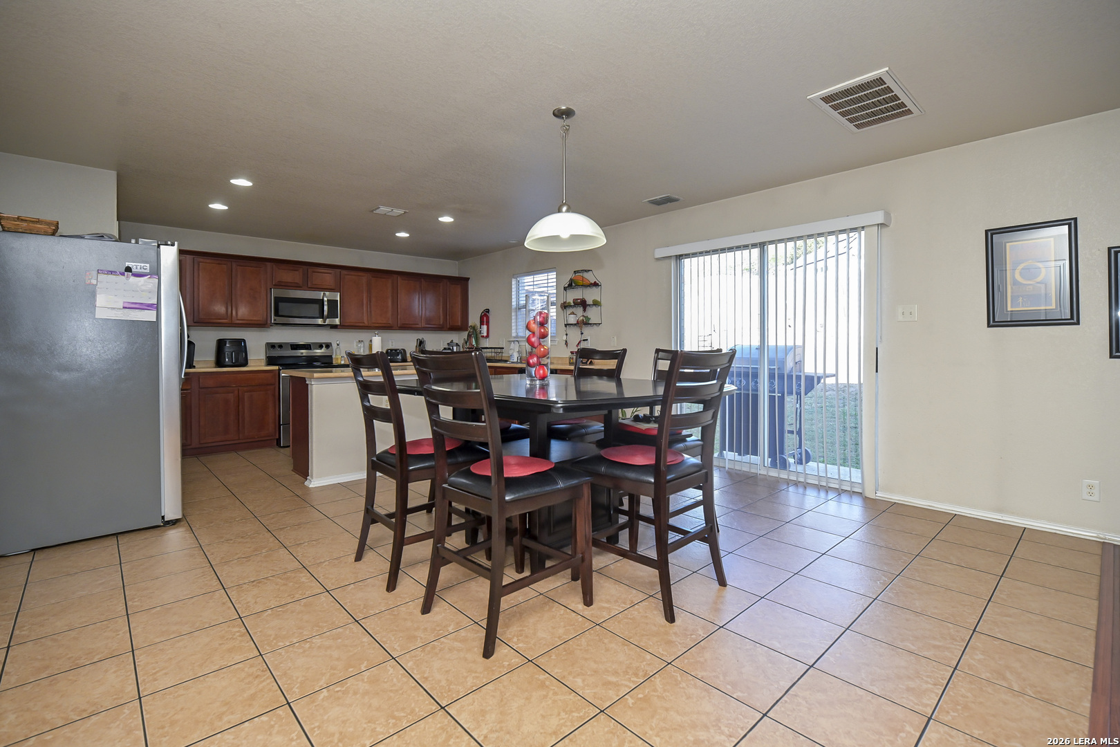 7207 Avery Road Live Oak, TX 78233 - Photo 15 of 42 a view of a dining room with furniture