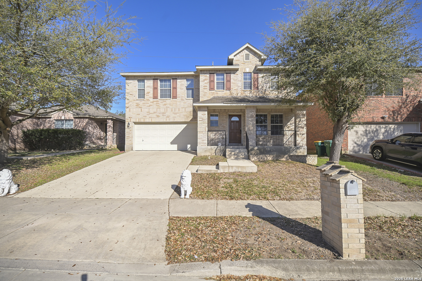 7207 Avery Road Live Oak, TX 78233 - Photo 2 of 42 a view of a white house with large windows next to a road