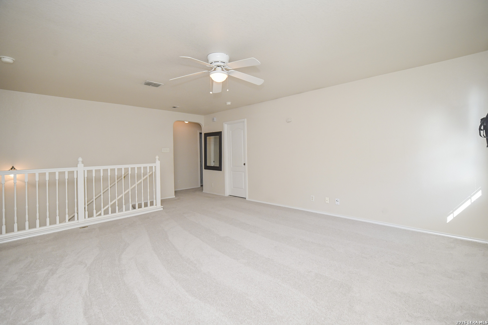 7207 Avery Road Live Oak, TX 78233 - Photo 22 of 42 an empty room with a ceiling fan and window
