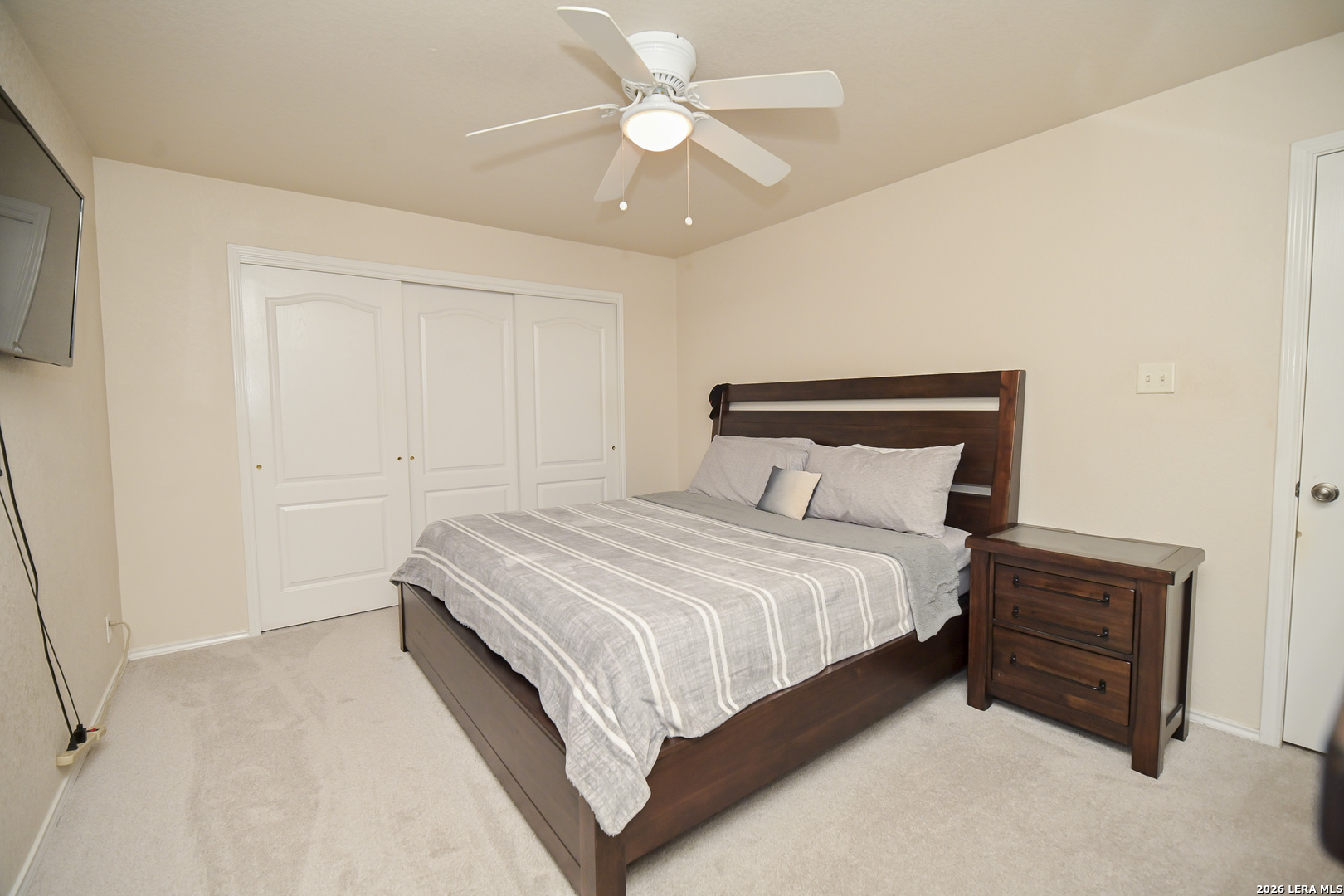 7207 Avery Road Live Oak, TX 78233 - Photo 26 of 42 a bedroom with a bed and a ceiling fan