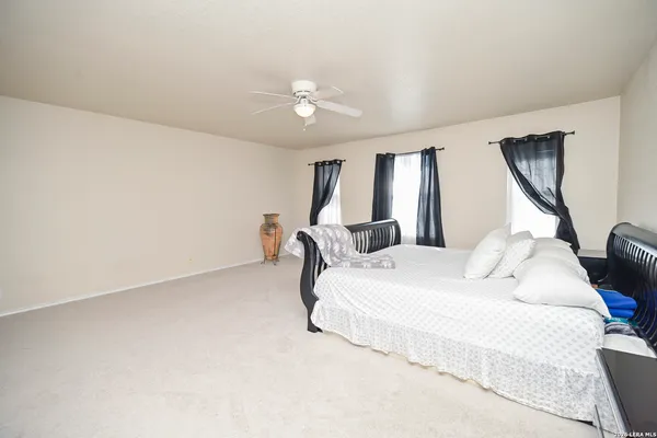a bedroom with bed and window