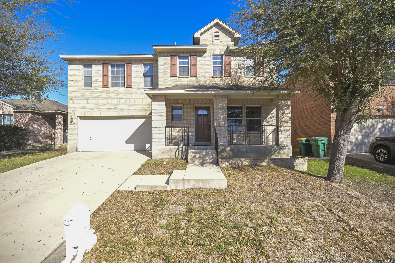 7207 Avery Road Live Oak, TX 78233 - Photo 3 of 42 a front view of a house with a yard and garage
