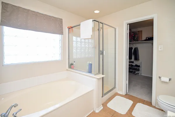 a bathroom with a bathtub and a toilet