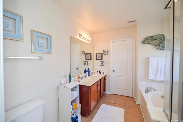a utility room with cabinets washer and dryer