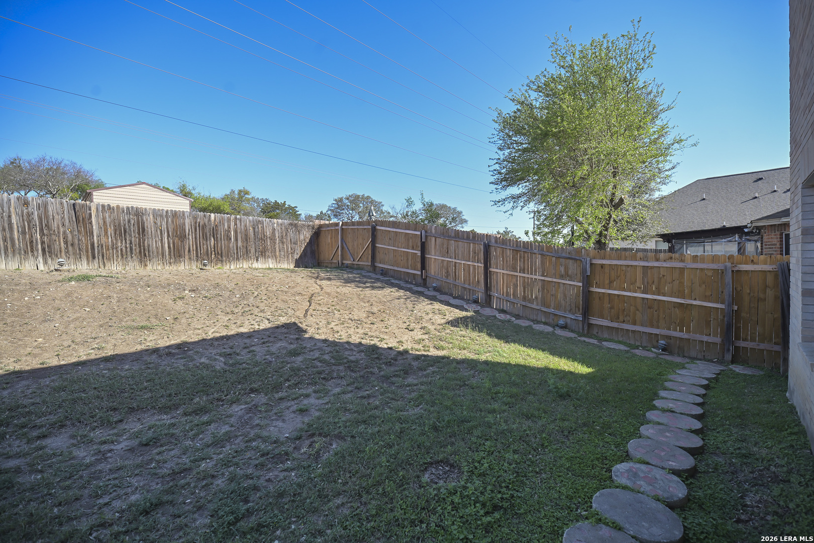 7207 Avery Road Live Oak, TX 78233 - Photo 37 of 42 a view of a backyard with wooden fence