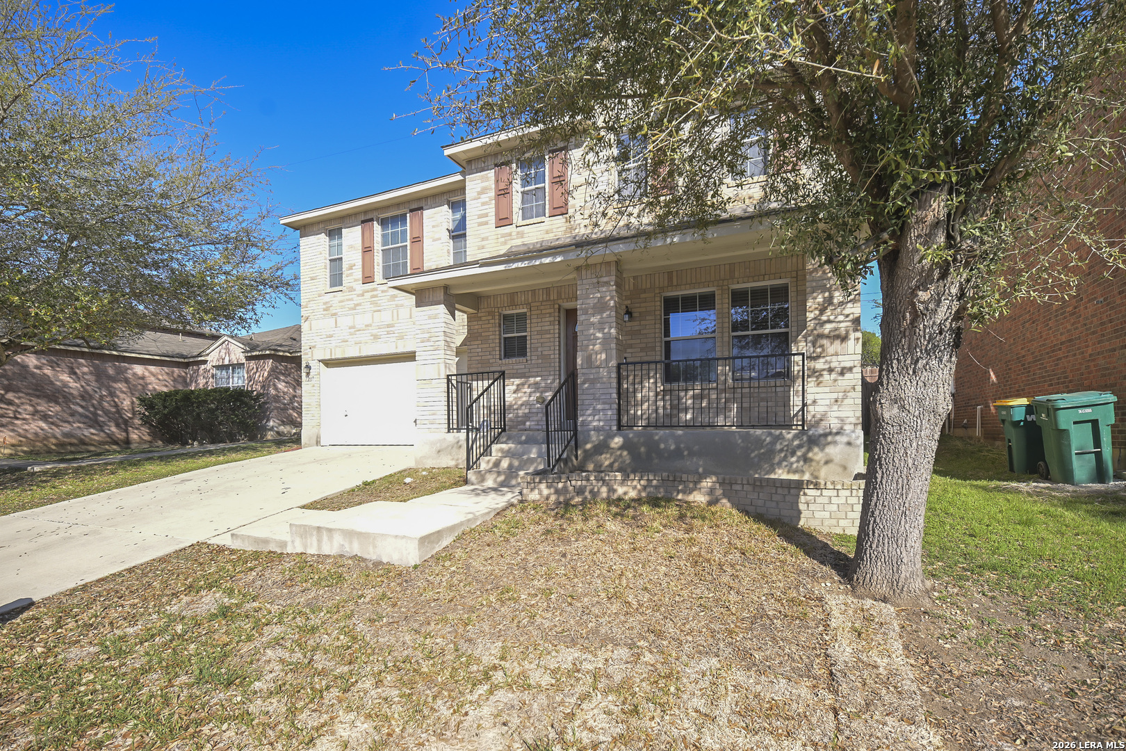 7207 Avery Road Live Oak, TX 78233 - Photo 4 of 42 a front view of a house with garden