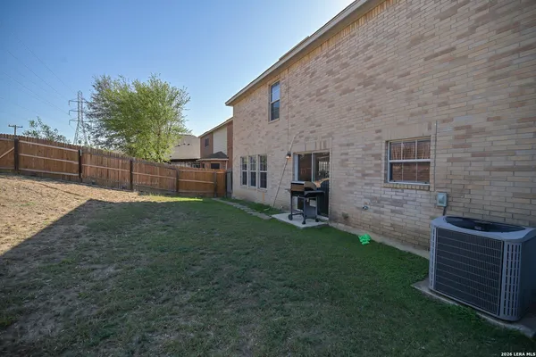 a backyard of a house with lots of green space